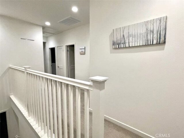 hallway featuring carpet flooring