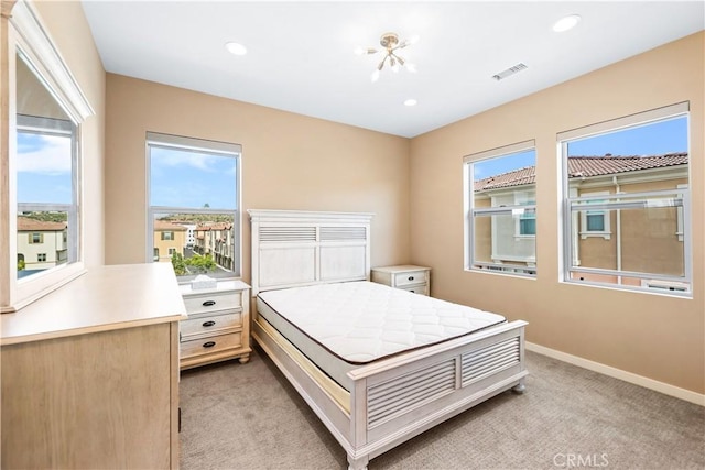 bedroom with light colored carpet