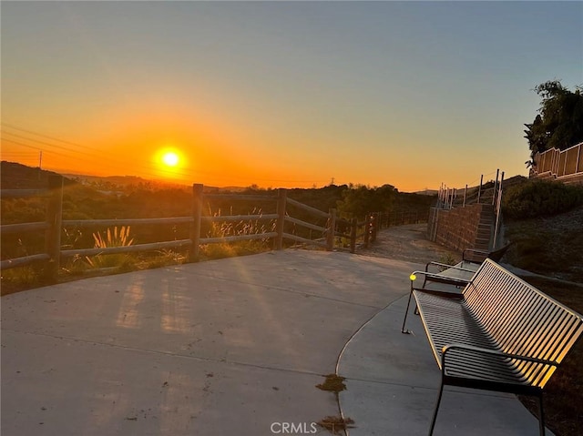 view of patio terrace at dusk