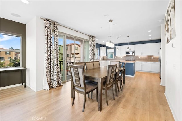 dining area with light hardwood / wood-style flooring