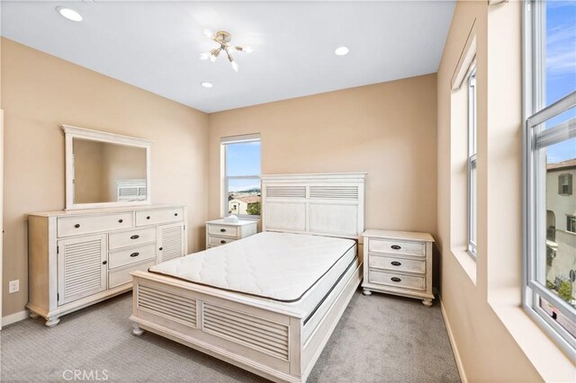 bedroom featuring light colored carpet