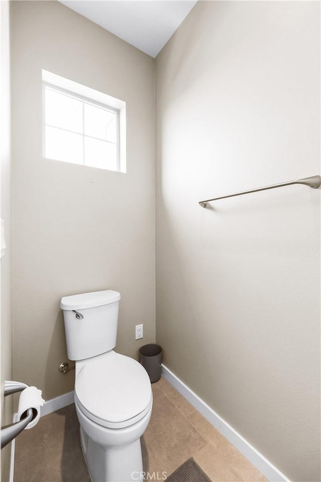 bathroom featuring tile patterned floors and toilet