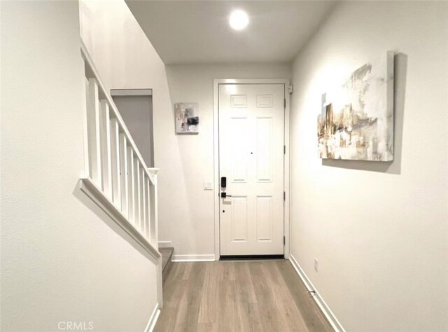 doorway to outside with hardwood / wood-style flooring