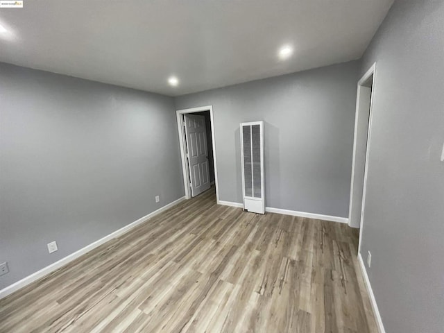 spare room with light hardwood / wood-style floors