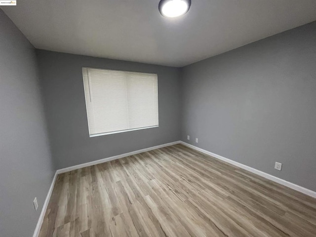 spare room featuring light hardwood / wood-style floors