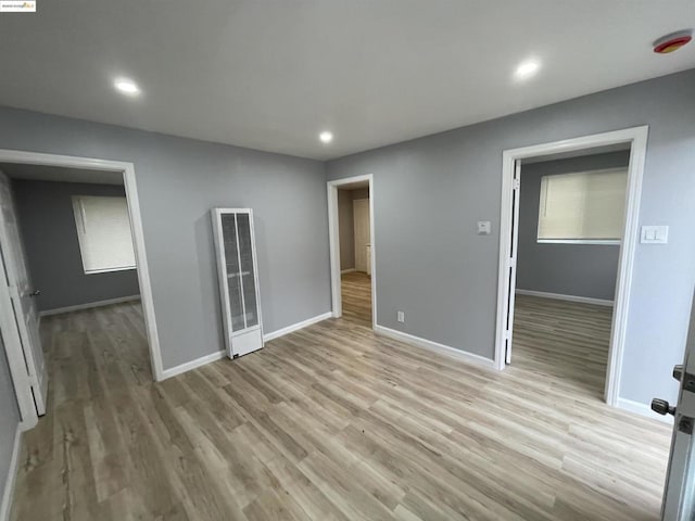 empty room with light wood-type flooring