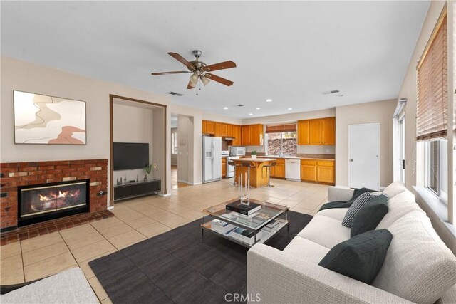 living room featuring visible vents, recessed lighting, ceiling fan, and light tile patterned floors
