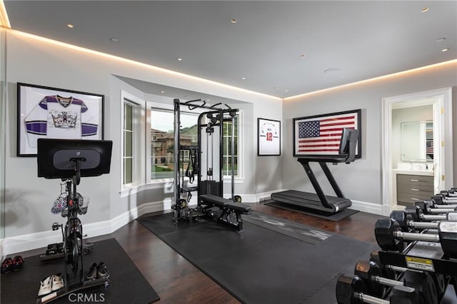 workout room with dark hardwood / wood-style floors