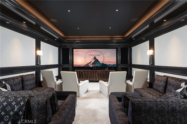 carpeted home theater featuring crown molding