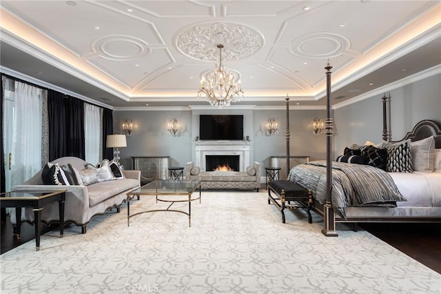 bedroom featuring ornamental molding, coffered ceiling, and a chandelier