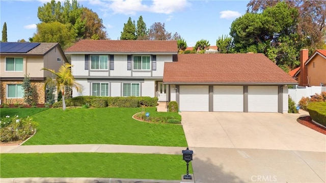 front of property with a garage and a front yard