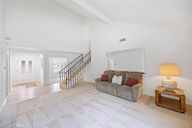 living room with light carpet, beam ceiling, and high vaulted ceiling