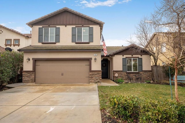 view of front of property with a garage and a front yard