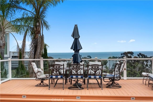 wooden terrace with a water view