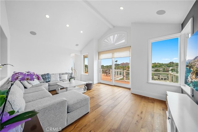 living area with recessed lighting, light wood-style flooring, high vaulted ceiling, beamed ceiling, and baseboards