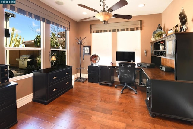 office with hardwood / wood-style floors and ceiling fan