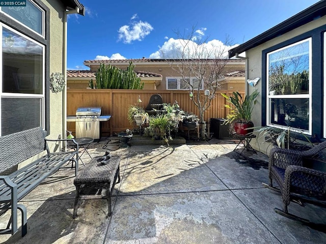 view of patio with a grill