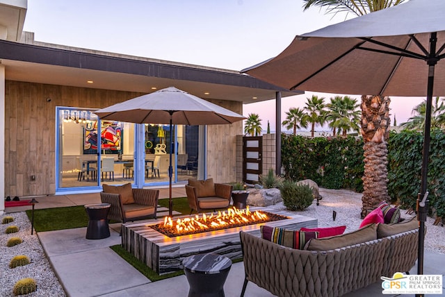 patio terrace at dusk with a fire pit