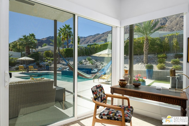 doorway to outside featuring a mountain view