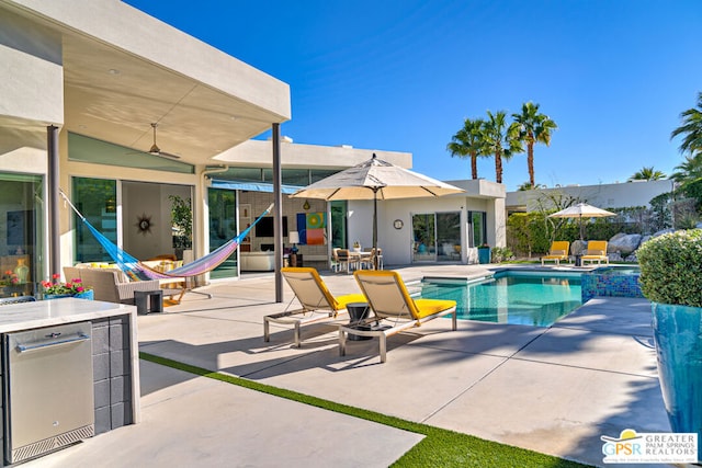 view of swimming pool featuring a patio