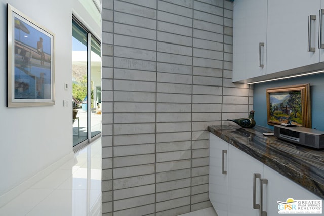 bathroom with vanity and tile patterned floors