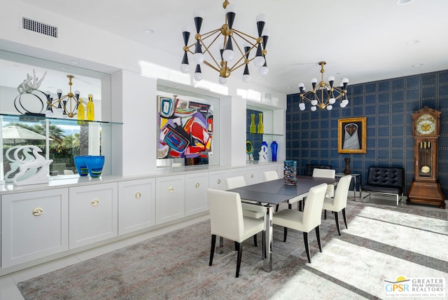 dining room with an inviting chandelier and light tile patterned floors