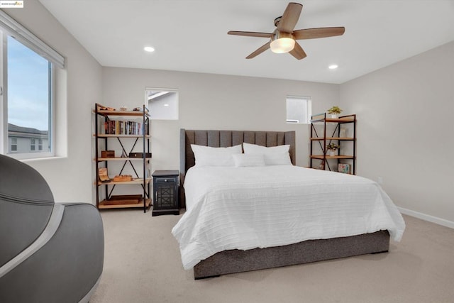 carpeted bedroom featuring ceiling fan