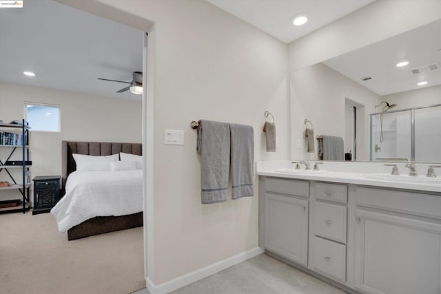 bathroom featuring vanity, a shower with door, and ceiling fan