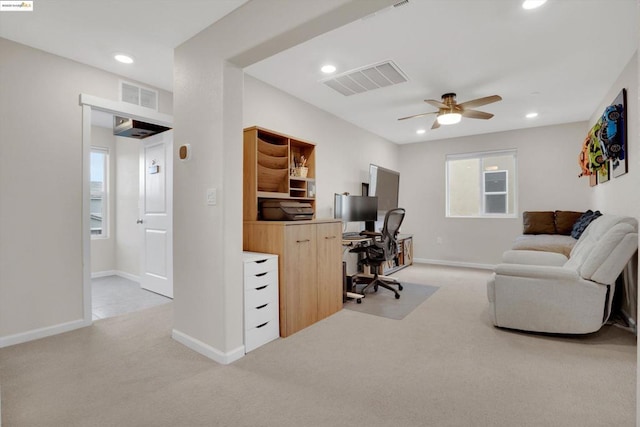 office with light colored carpet and ceiling fan