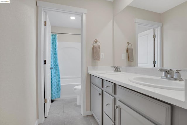 full bathroom with vanity, tile patterned flooring, toilet, and shower / bath combo