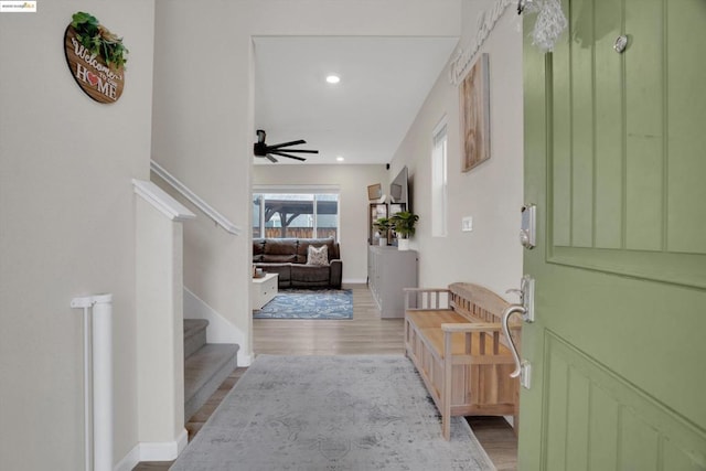 interior space featuring ceiling fan and light wood-type flooring