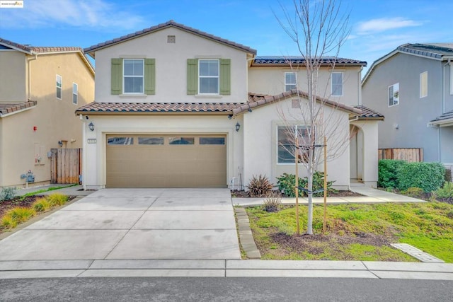 mediterranean / spanish-style house with a garage