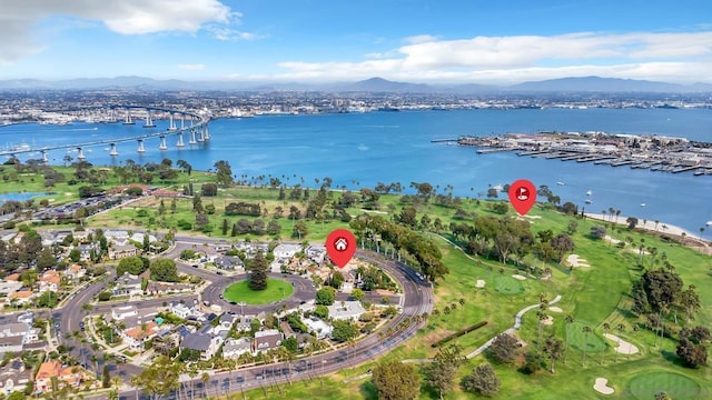 drone / aerial view with a water and mountain view