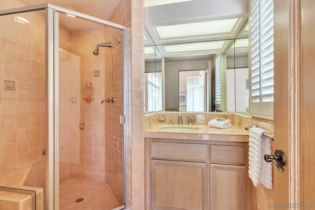 bathroom featuring vanity and walk in shower