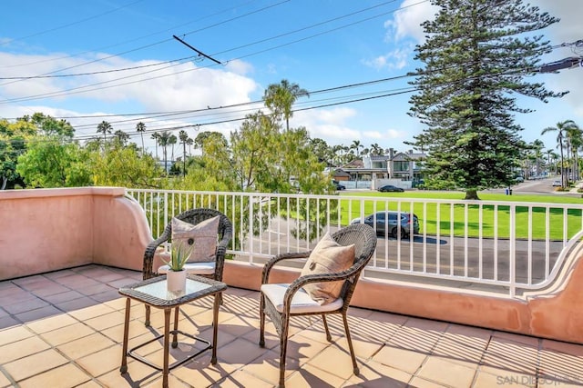 view of patio featuring a balcony