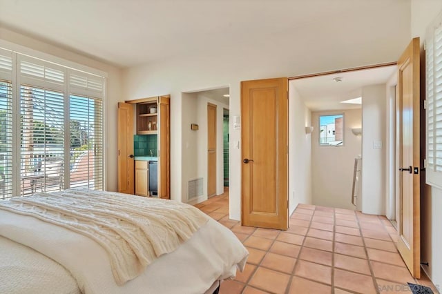 bedroom featuring light tile patterned floors