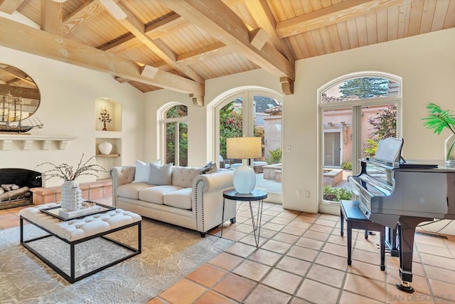 living room with lofted ceiling with beams, wooden ceiling, and french doors