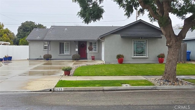 ranch-style house with a front lawn