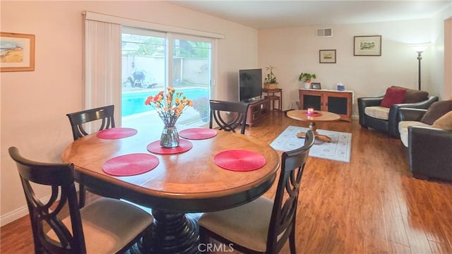 dining space featuring hardwood / wood-style floors