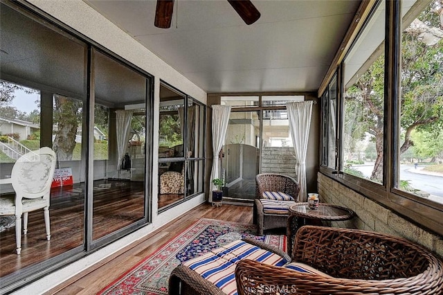 sunroom / solarium with ceiling fan