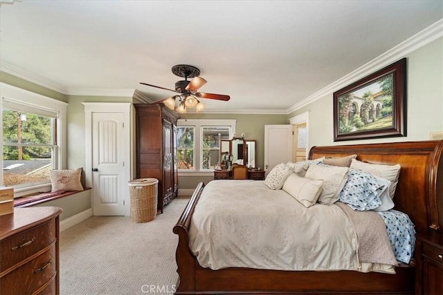 bedroom featuring light carpet, crown molding, and ceiling fan