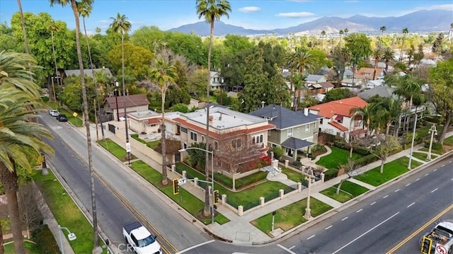 birds eye view of property with a mountain view