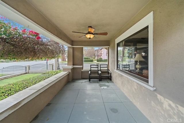 view of patio featuring covered porch and ceiling fan