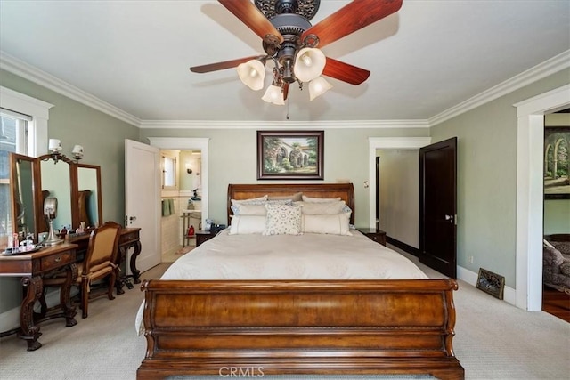 carpeted bedroom featuring crown molding and ceiling fan