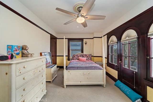 carpeted bedroom featuring ceiling fan and french doors