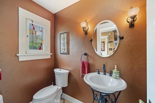 bathroom featuring sink and toilet