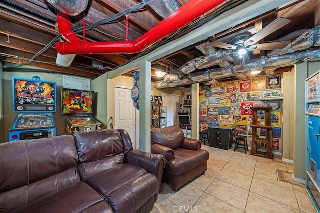 basement with tile patterned flooring and ceiling fan