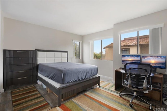 bedroom with hardwood / wood-style flooring