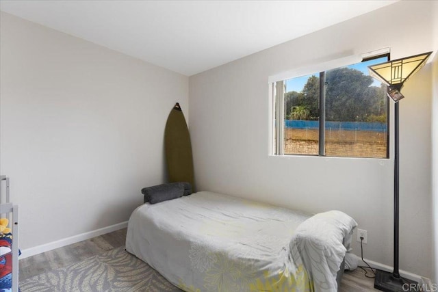 bedroom with hardwood / wood-style floors