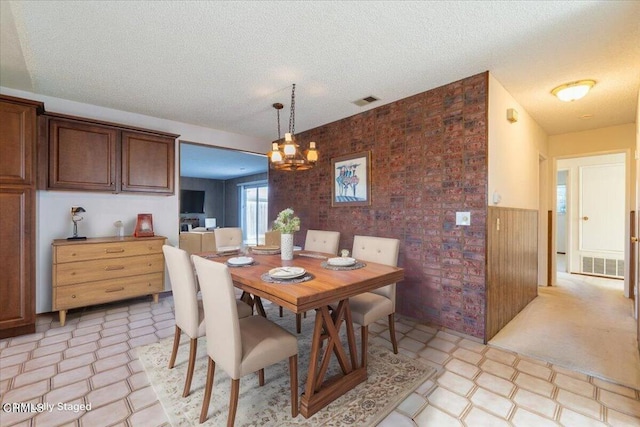 dining room with a textured ceiling